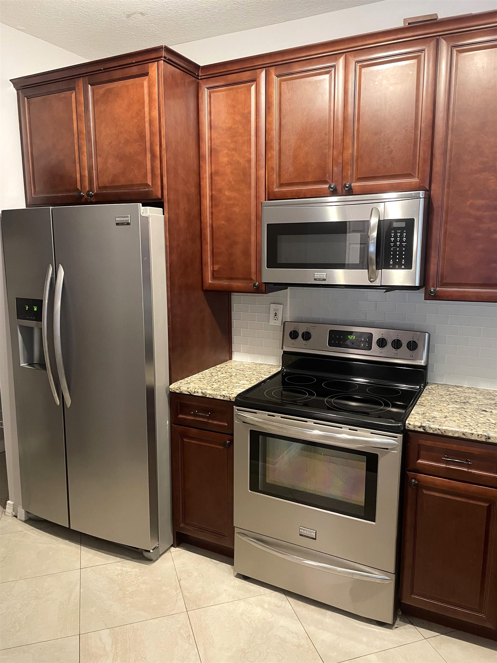 605 Fairway Drive, Unit 107 St. Augustine, FL 32084 - Photo 5 of 20 a kitchen with a stove microwave and refrigerator