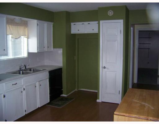 4526 Hogan Street Corpus Christi, TX 78413 - Photo 3 of 3 a kitchen with a sink and cabinets