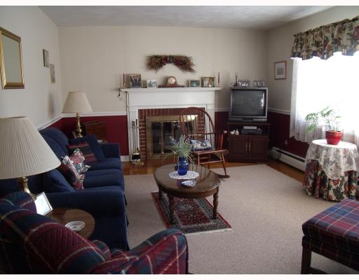 15 Wilson Road Middletown, RI 02842 - Photo 2 of 12 Living Room. With wood burning fireplace