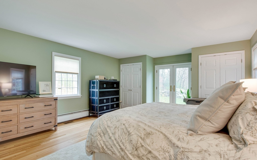 48 Miller Hill Road Dover, MA 02030 - Photo 12 of 26 a bedroom with a bed and furniture