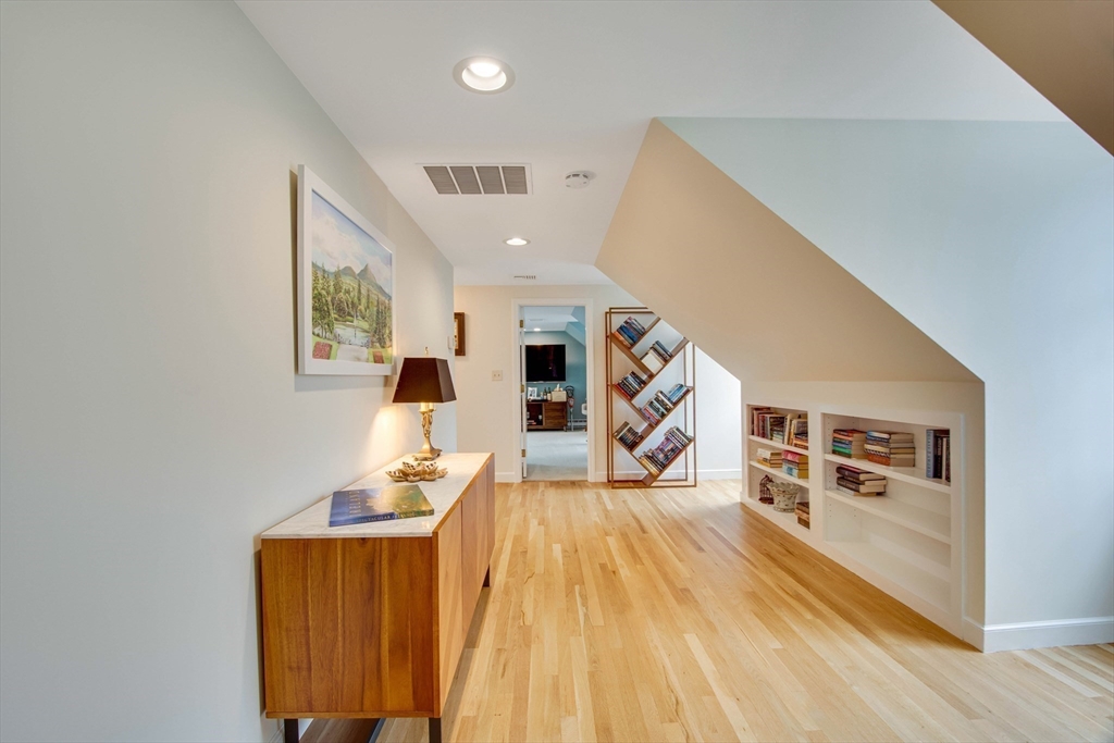 48 Miller Hill Road Dover, MA 02030 - Photo 18 of 26 a living room with furniture and a wooden floor