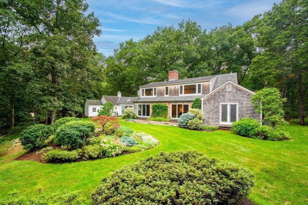 48 Miller Hill Road Dover, MA 02030 - Photo 24 of 26 a front view of a house with yard and green space