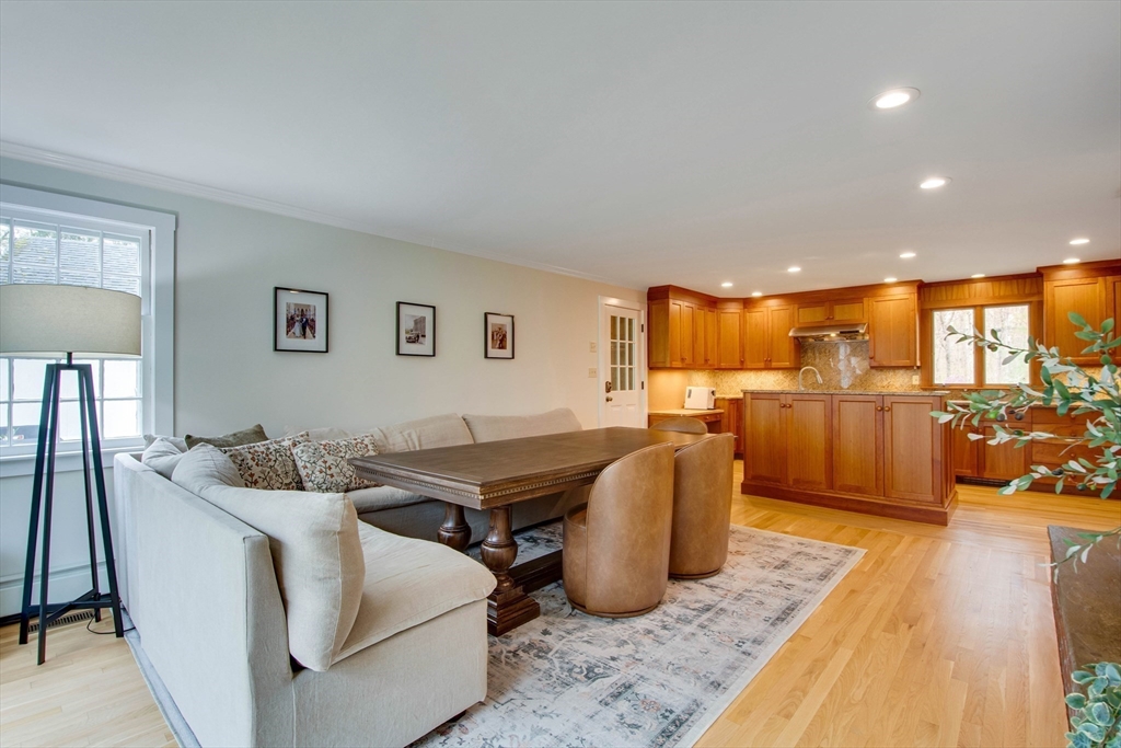 48 Miller Hill Road Dover, MA 02030 - Photo 5 of 26 a living room with furniture kitchen view and a wooden floor