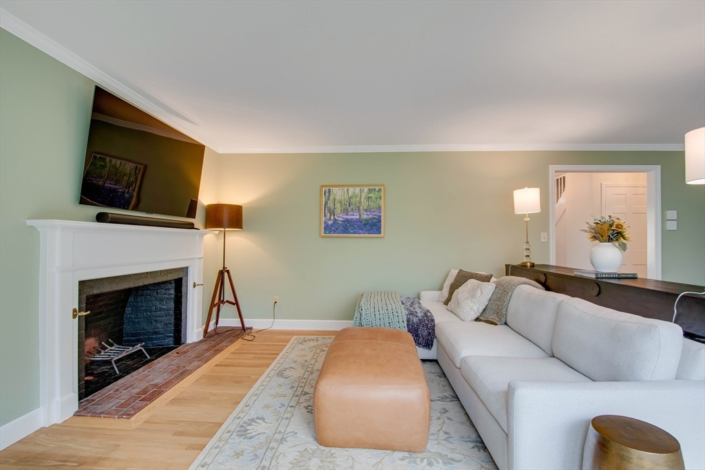 48 Miller Hill Road Dover, MA 02030 - Photo 9 of 26 a bedroom with a bed and a flat screen tv