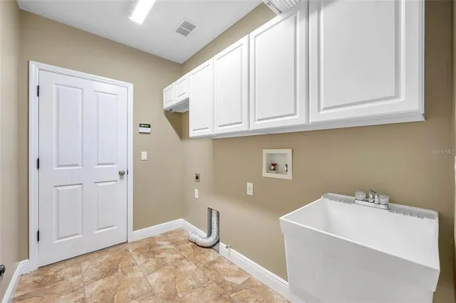 a bathroom with a sink and cabinets