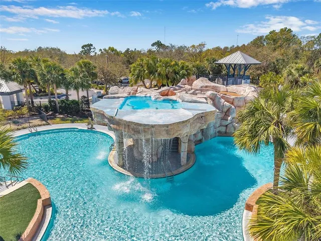 a view of a house with a yard and balcony
