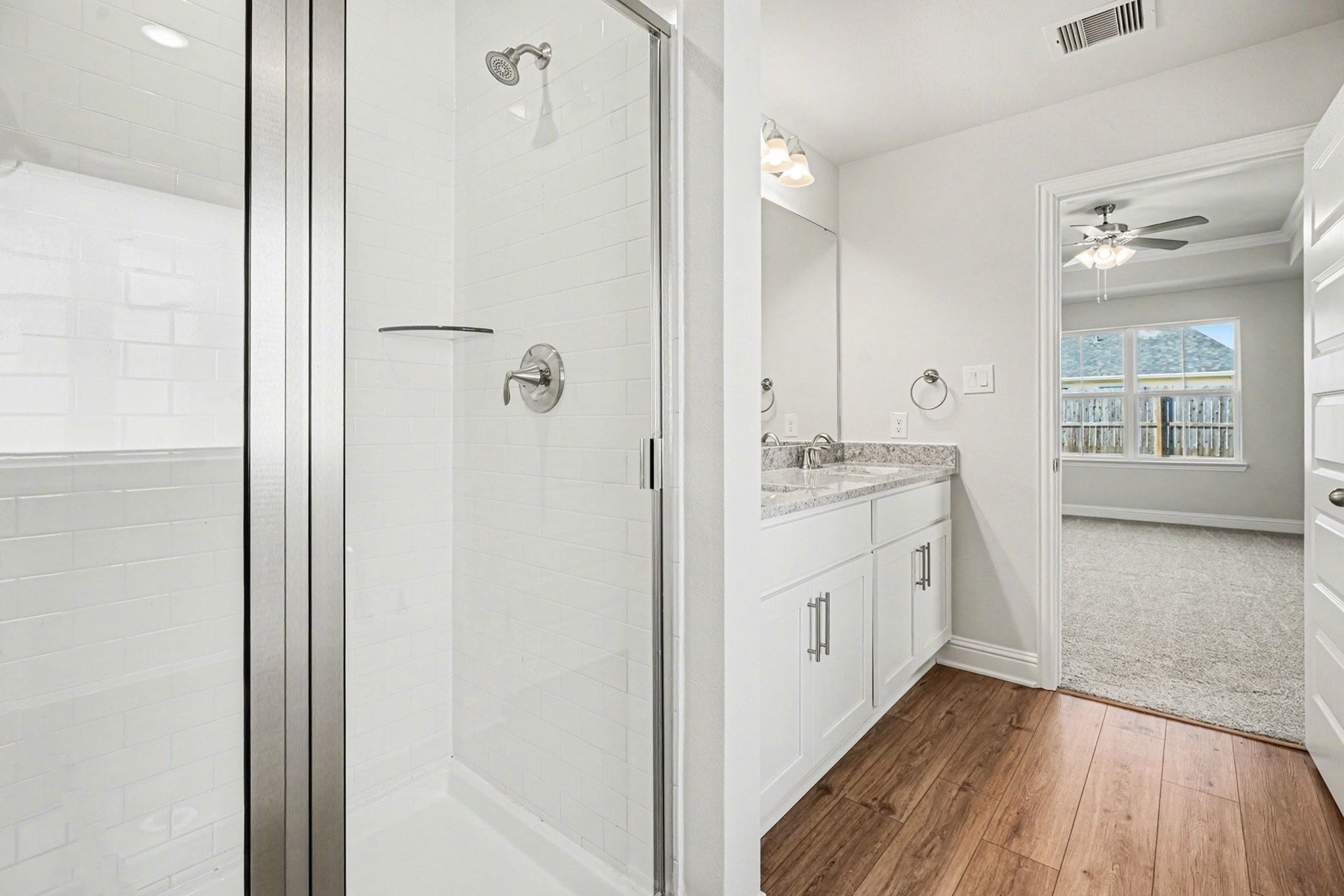 5 Keystone Court Angleton, TX 77515 - Photo 20 of 33 a bathroom with a sink a mirror and a shower