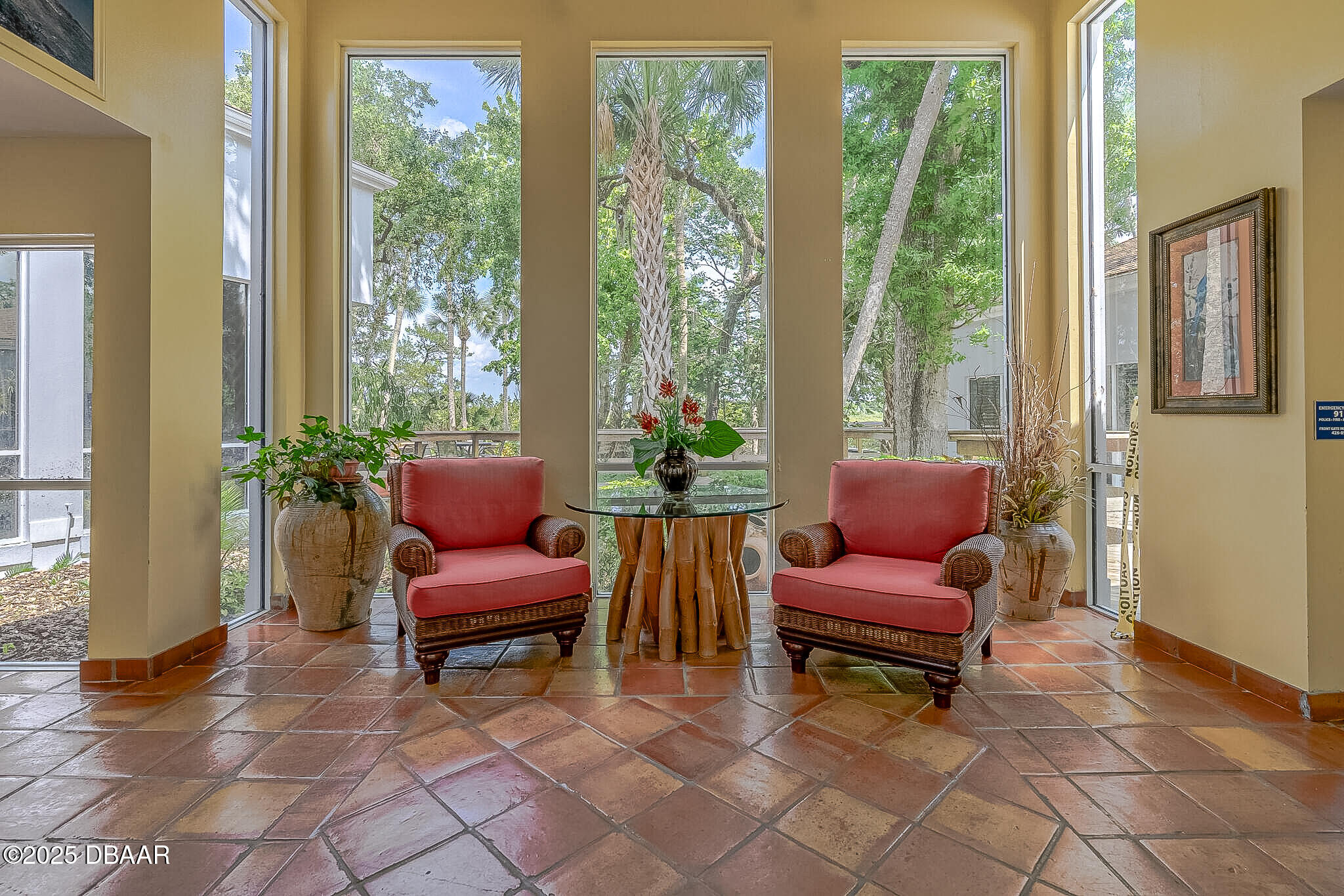 730 Navigators Way Edgewater, FL 32141 - Photo 54 of 68 a living room with furniture and a floor to ceiling window