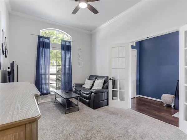 a bedroom with furniture and a window