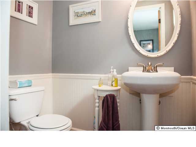280 Sudbury Road Point Pleasant, NJ 08742 - Photo 14 of 20 a bathroom with a sink mirror and toilet