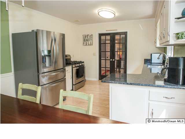 280 Sudbury Road Point Pleasant, NJ 08742 - Photo 4 of 20 a kitchen with stainless steel appliances granite countertop a refrigerator and a stove top oven