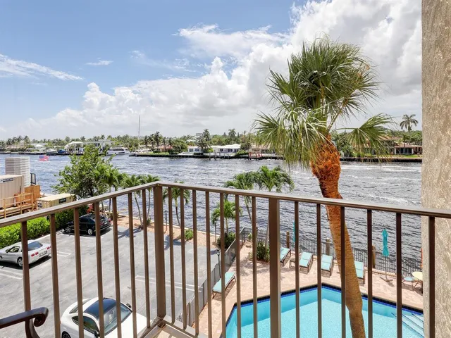 a bathroom with a sink mirror and shower