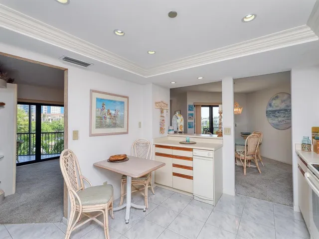 a en suite bathroom with a granite countertop sink mirror and a bathtub