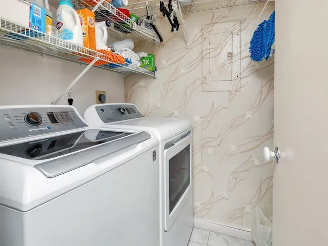 a view of swimming pool with outdoor seating and plants