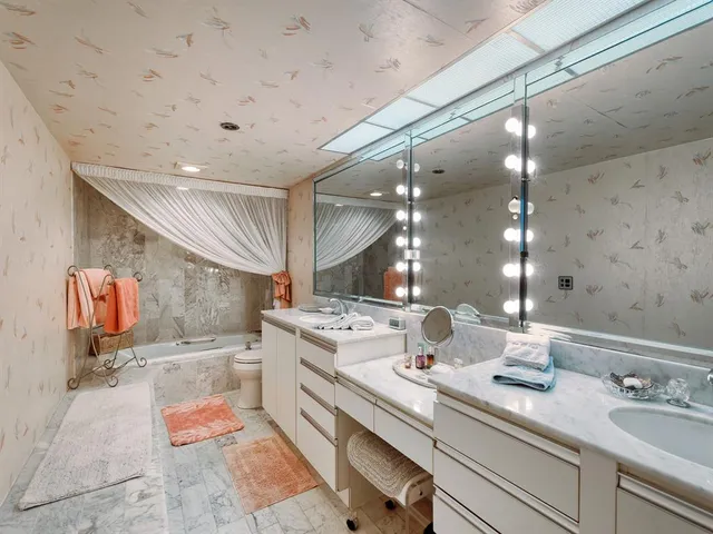 a view of a backyard with a patio table and chairs