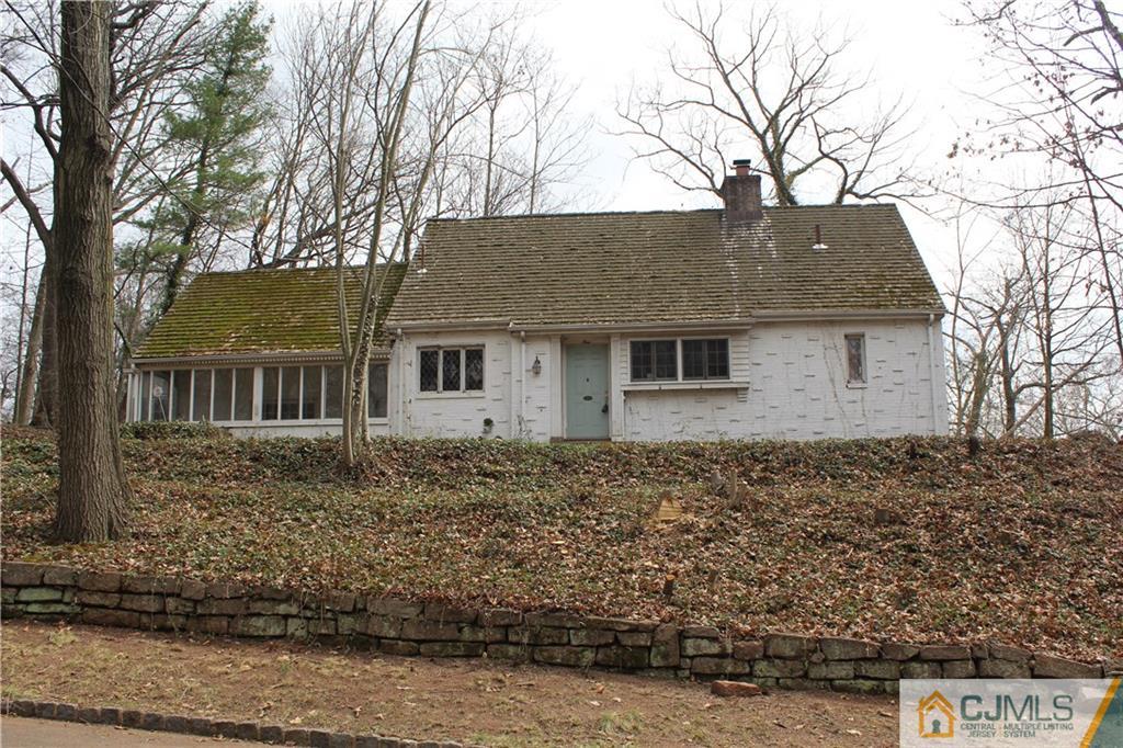 1 Edgebrook Road New Brunswick, NJ 08901 - Photo 2 of 8 a house that has a tree in front of it