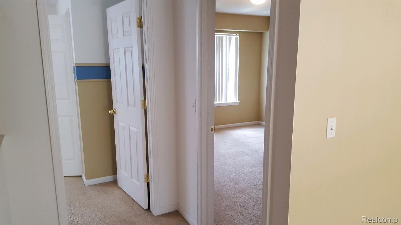 4689 Summer Ridge Drive, Unit 22 Howell, MI 48843 - Photo 4 of 9 22SP UPSTAIRS BEDROOM 1.jpg