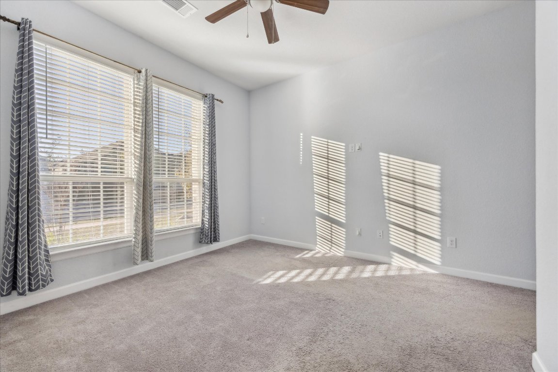 623 Baretta Loop Buda, TX 78610 - Photo 8 of 10 an empty room with windows and closet