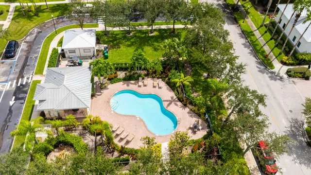 an aerial view of residential house with outdoor space and swimming pool