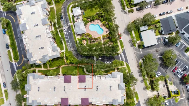 an aerial view of a house with swimming pool