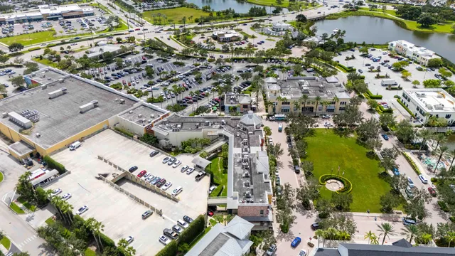 an aerial view of residential house with outdoor space and swimming pool