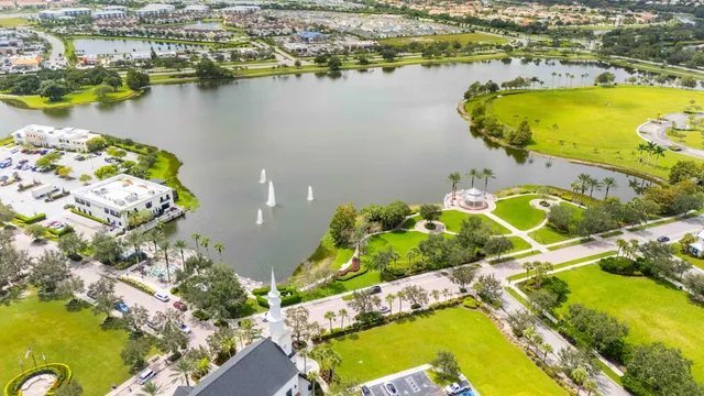 an aerial view of a house with a lake view