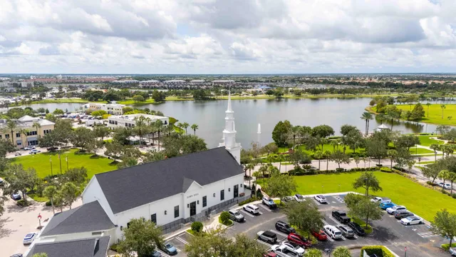 an aerial view of a house with a lake view