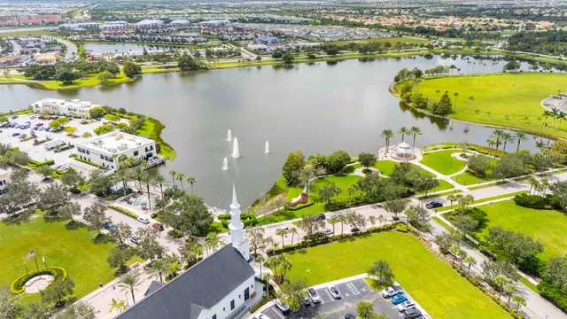 an aerial view of a residential houses with swimming pool and outdoor space