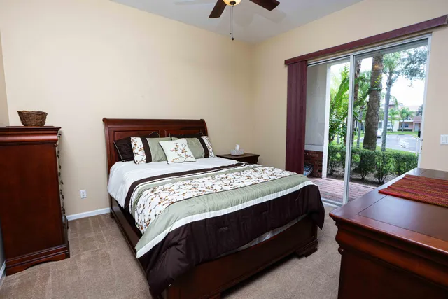 a bed sitting in a bedroom next to a window