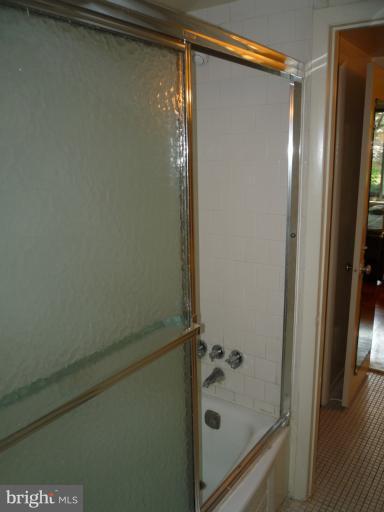 6 Cross Keys Road, Unit 6A Baltimore, MD 21210 - Photo 21 of 30 a bathroom with a glass shower door