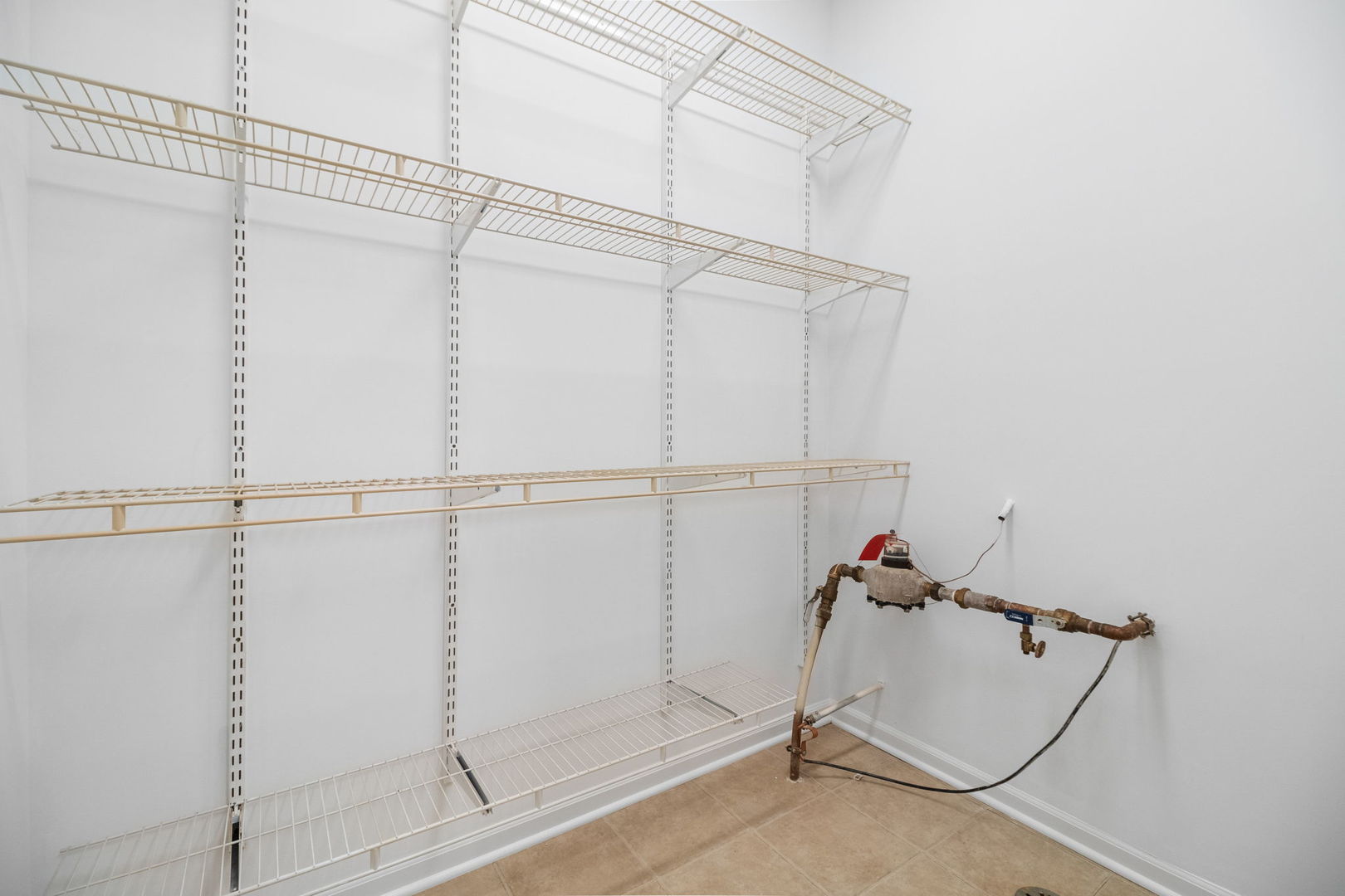 23908 Dayfield Drive, Unit 23908 Plainfield, IL 60586 - Photo 16 of 23 a view of a room with racks on the wall