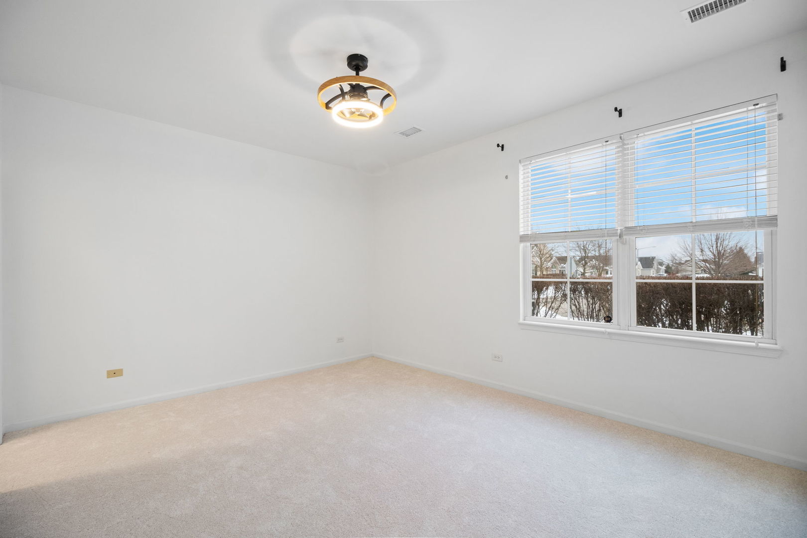23908 Dayfield Drive, Unit 23908 Plainfield, IL 60586 - Photo 18 of 23 a view of an empty room with a window