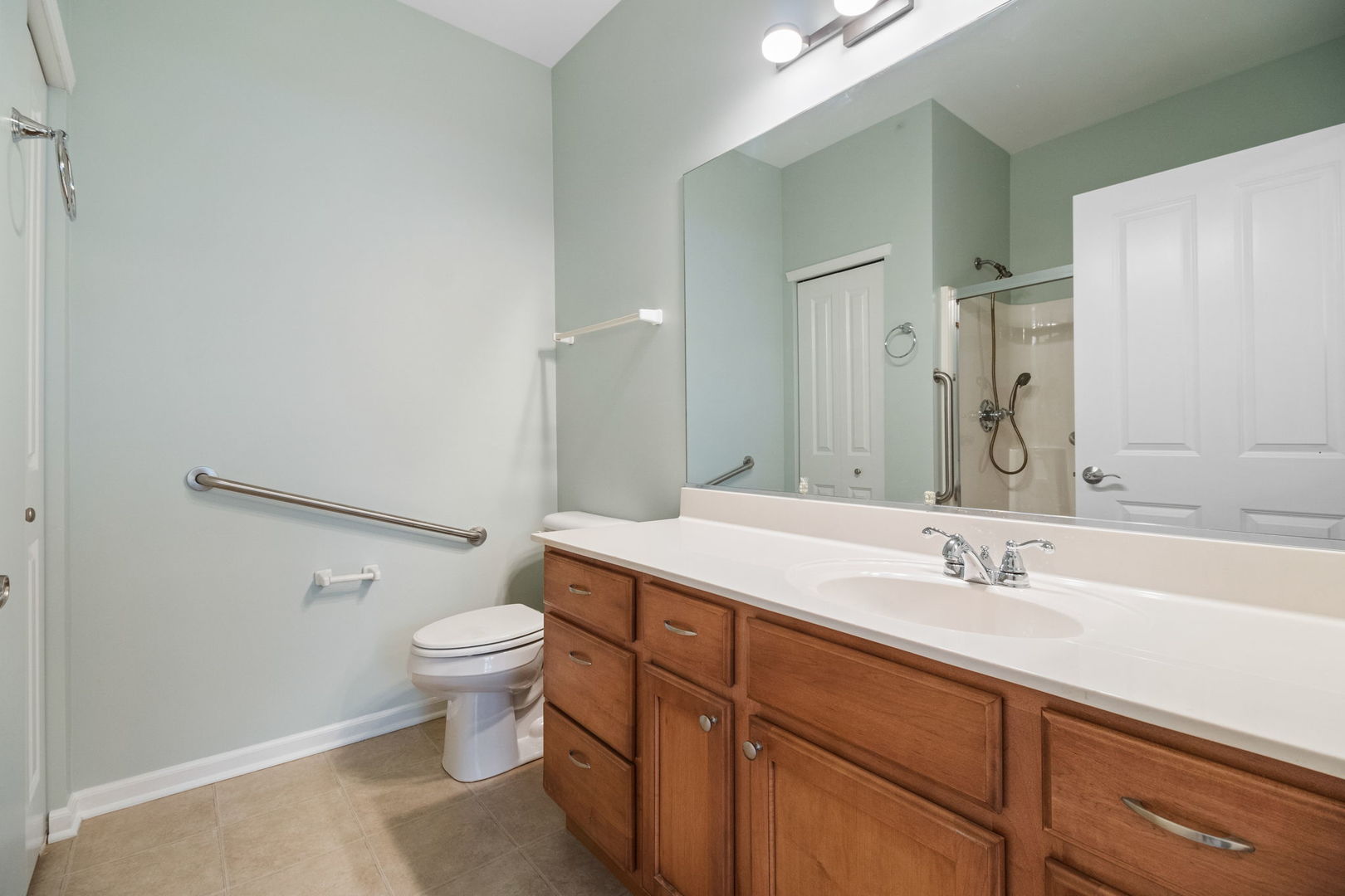 23908 Dayfield Drive, Unit 23908 Plainfield, IL 60586 - Photo 19 of 23 a bathroom with a sink toilet and shower