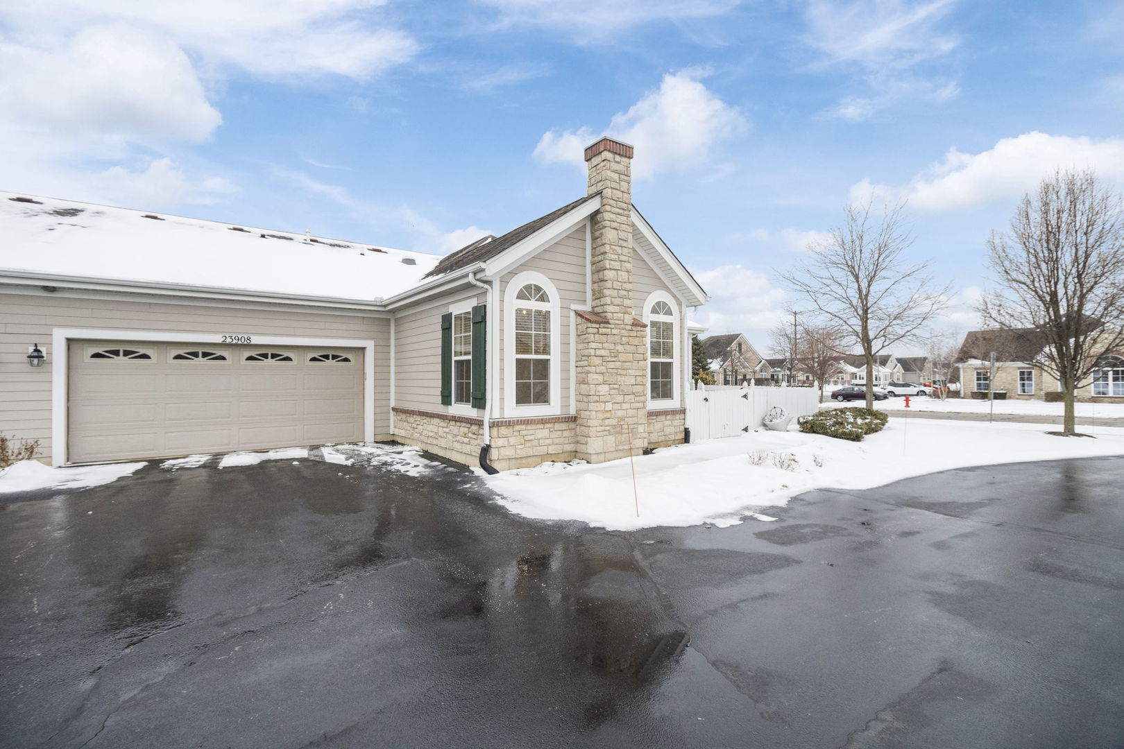 23908 Dayfield Drive, Unit 23908 Plainfield, IL 60586 - Photo 22 of 23 a view of a house with snow on the road