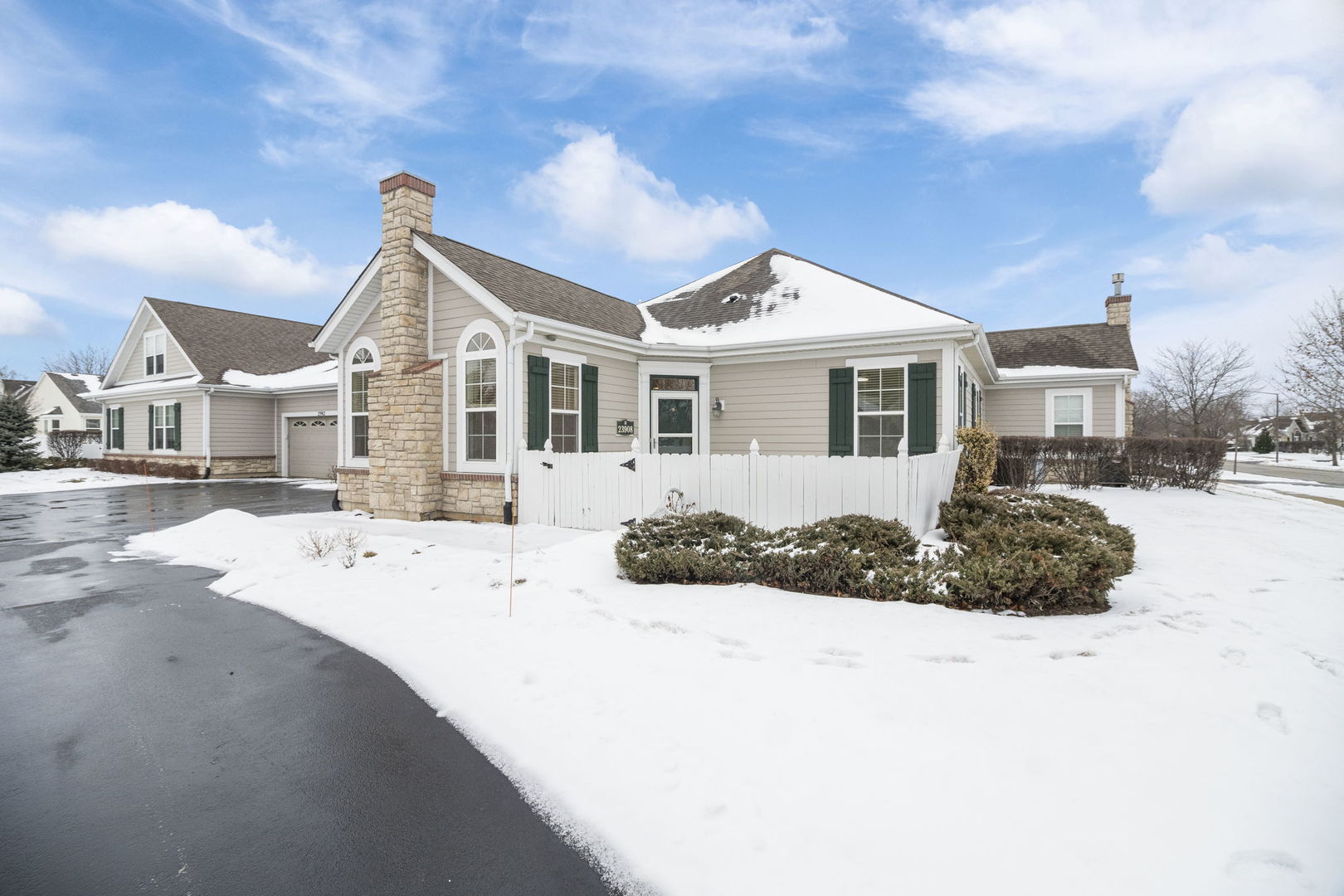 23908 Dayfield Drive, Unit 23908 Plainfield, IL 60586 - Photo 23 of 23 a view of a house with a yard covered in snow