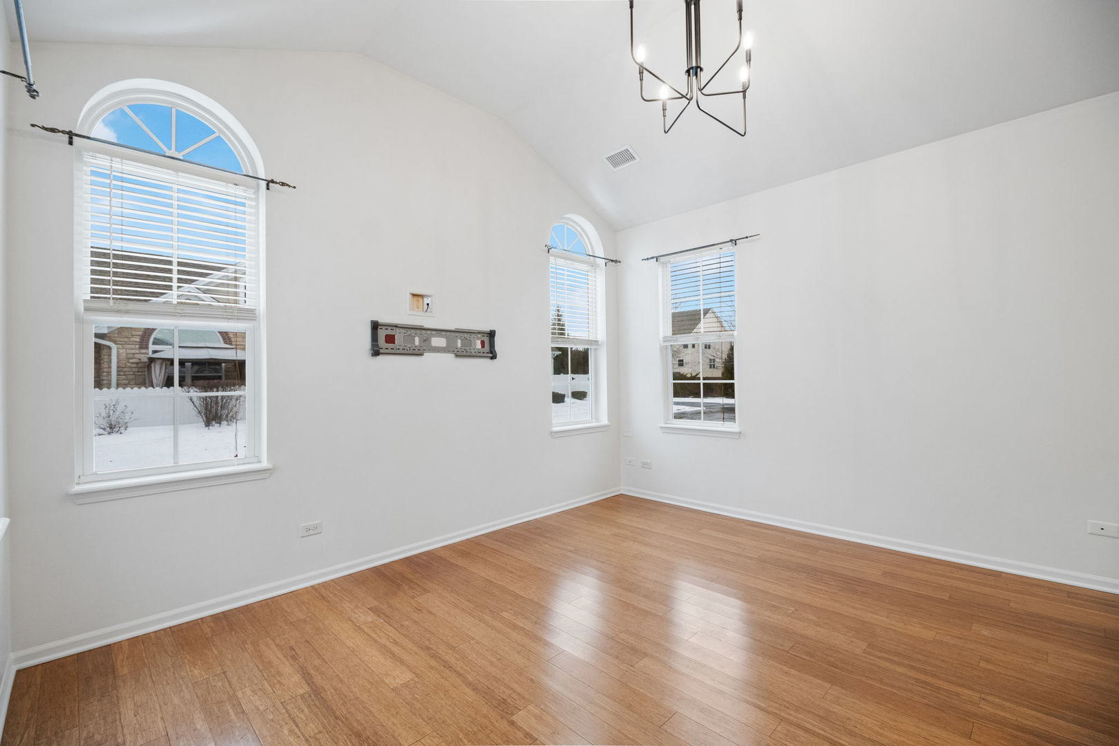 23908 Dayfield Drive, Unit 23908 Plainfield, IL 60586 - Photo 6 of 23 a view of empty room with wooden floor and fan