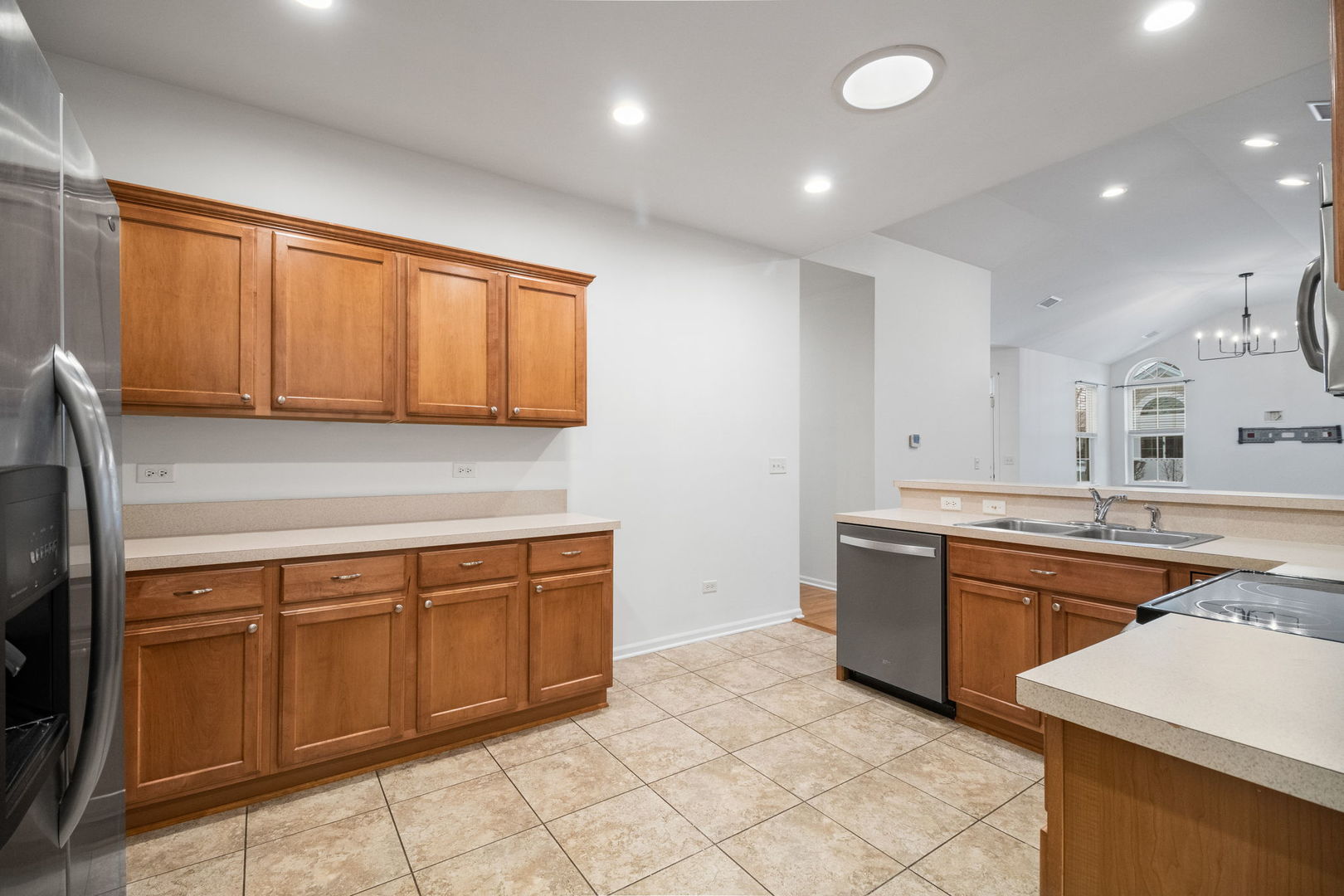 23908 Dayfield Drive, Unit 23908 Plainfield, IL 60586 - Photo 10 of 23 a kitchen with stainless steel appliances granite countertop a sink and cabinets