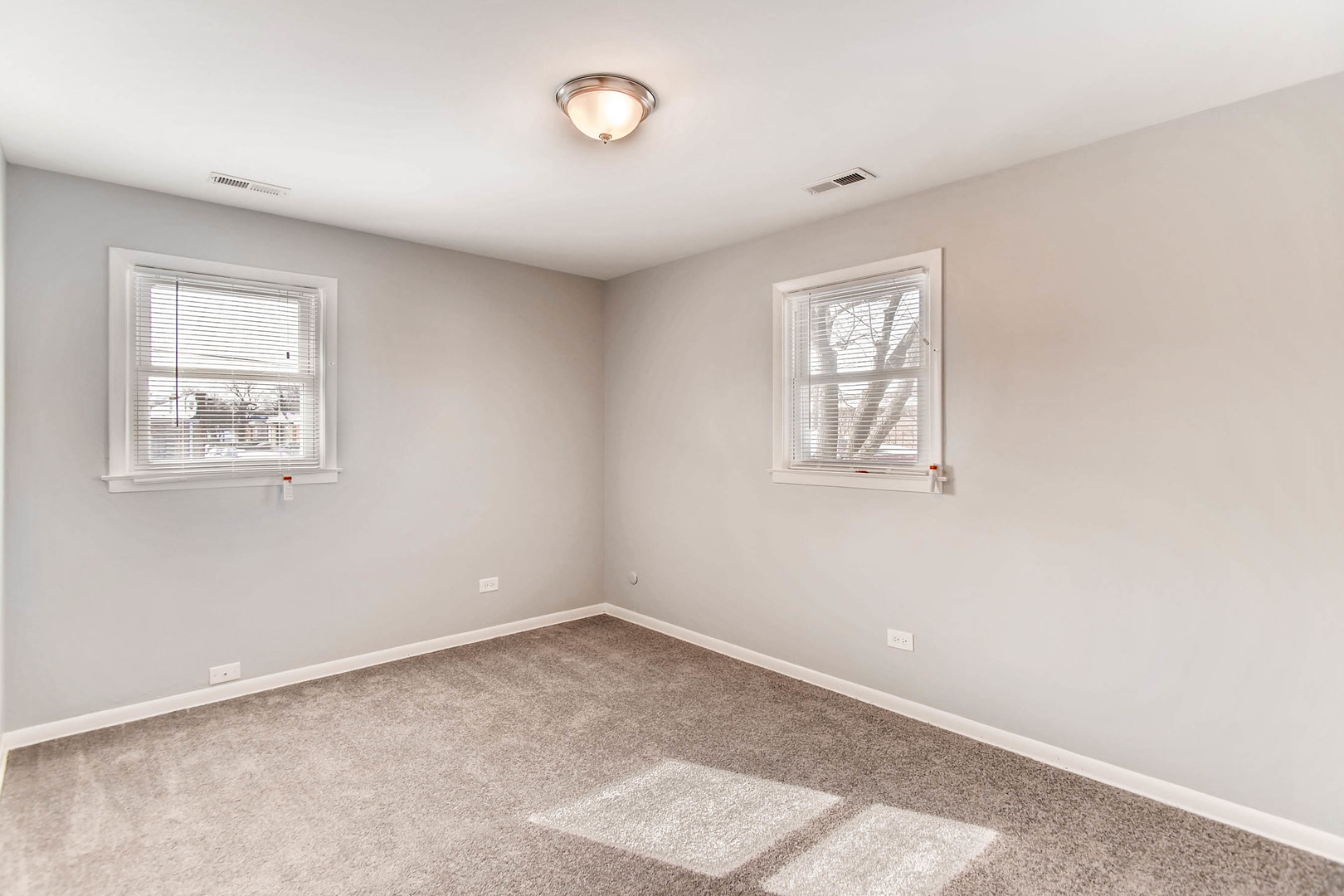 7233 38th Place Lyons, IL 60534 - Photo 18 of 26 an empty room with windows