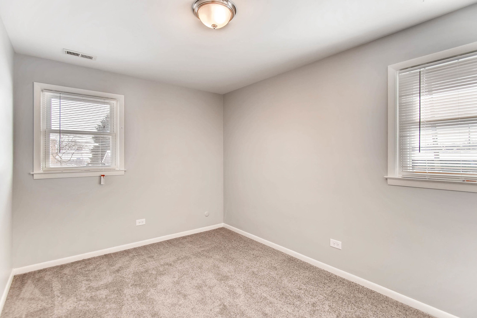 7233 38th Place Lyons, IL 60534 - Photo 19 of 26 an empty room with windows