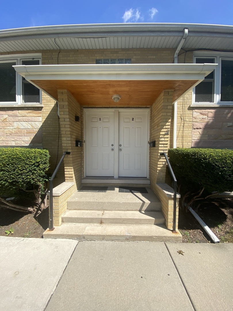7233 38th Place Lyons, IL 60534 - Photo 2 of 26 a view of a entryway door of the house
