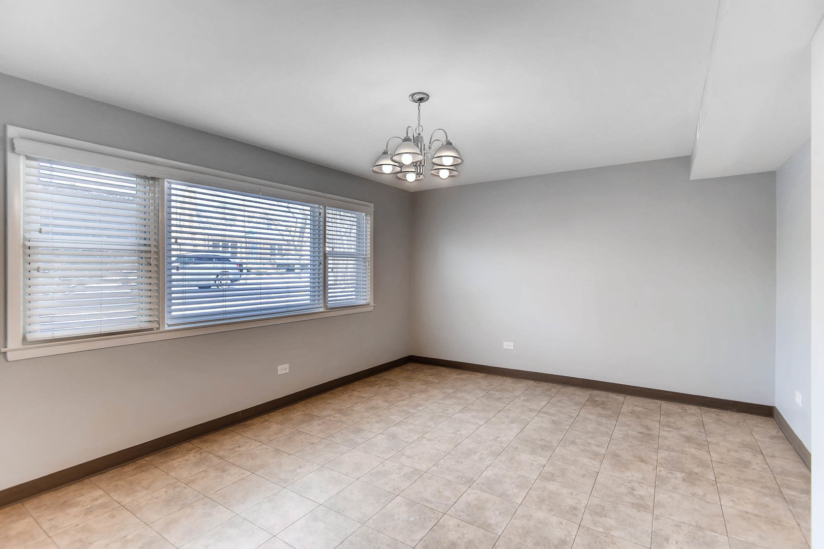 7233 38th Place Lyons, IL 60534 - Photo 7 of 26 a view of an empty room with a window
