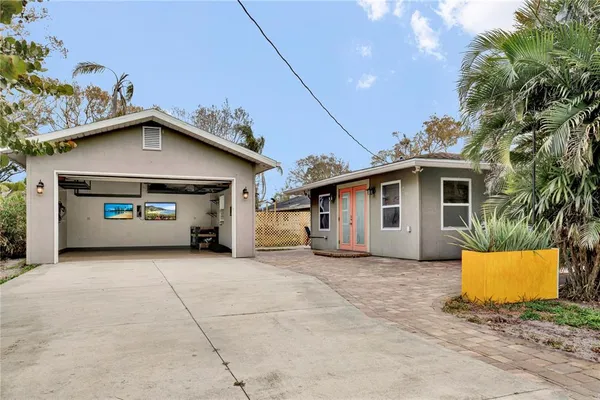 a view of a chairs and table in backyard