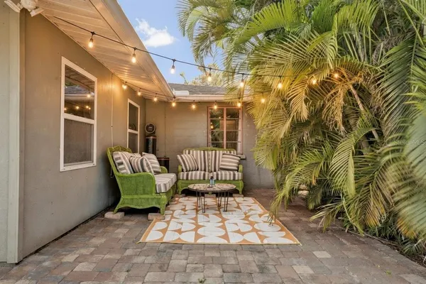 a view of a chair and table in the patio