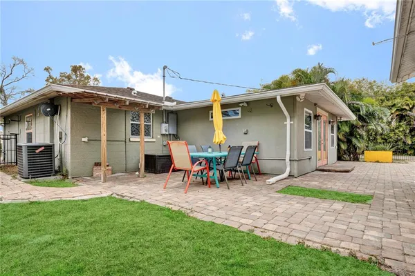 a view of a patio with table and chairs