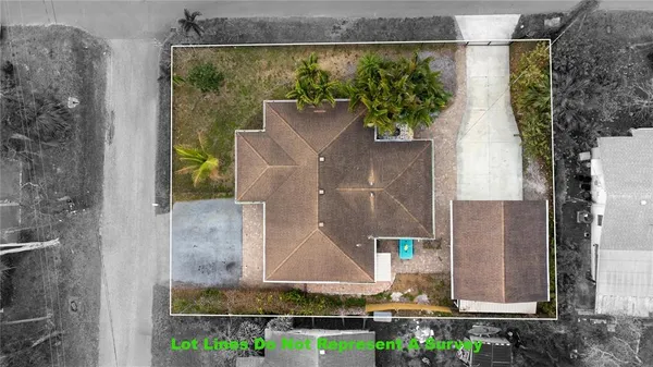 aerial view of a house with a yard