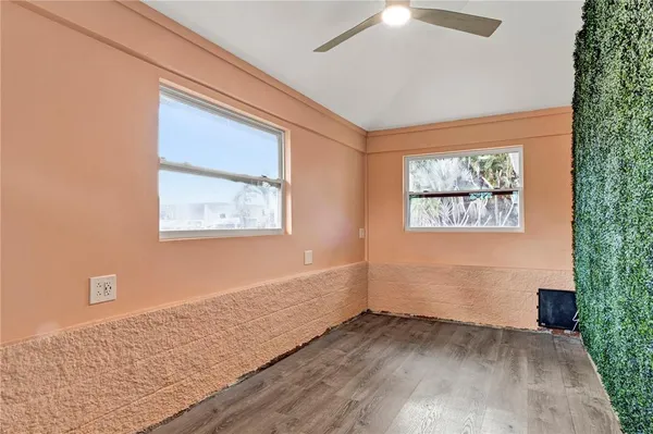 a view of a dining room with furniture and windows