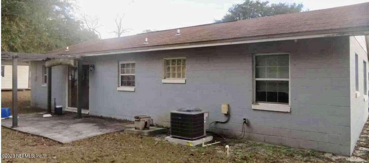 8345 Chessman Court Jacksonville, FL 32244 - Photo 4 of 6 a backyard of a house with barbeque oven