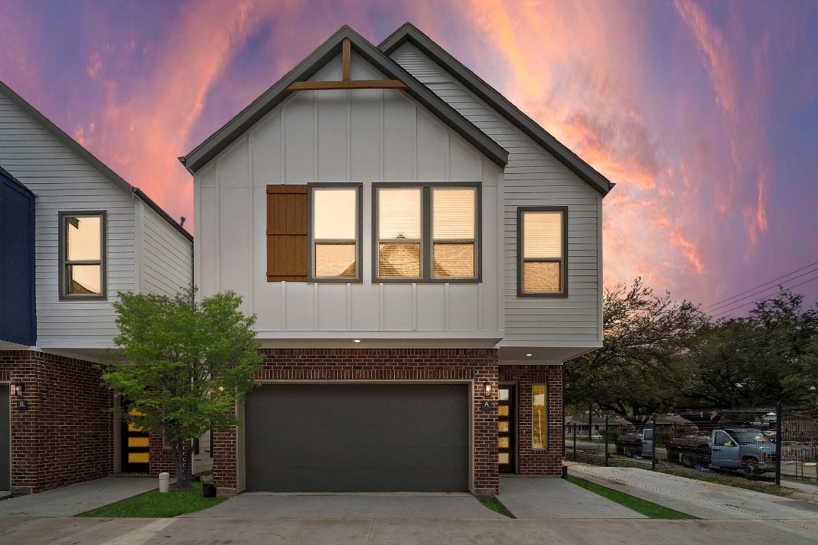 a front view of a house with a garage