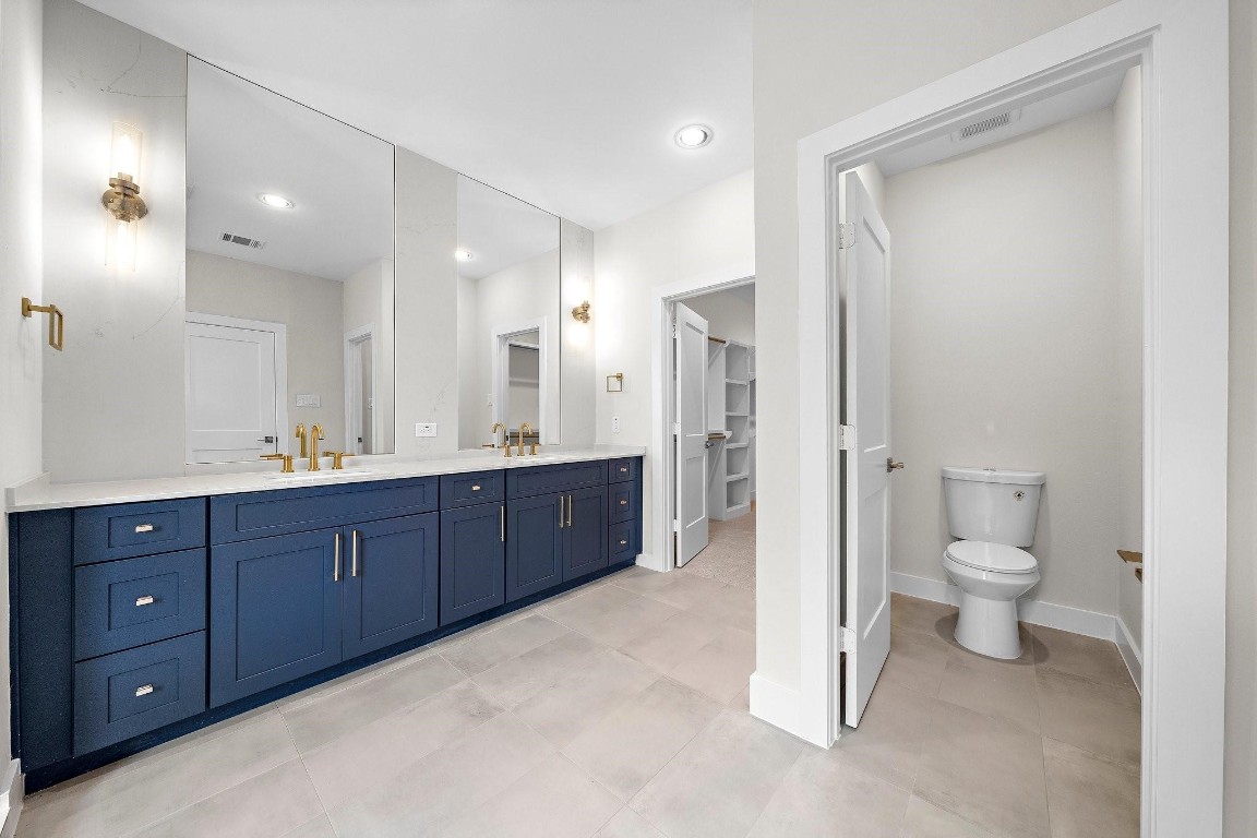 2200 Marnel Road, Unit I Houston, TX 77055 - Photo 16 of 25 a spacious bathroom with a granite countertop sink mirror and toilet