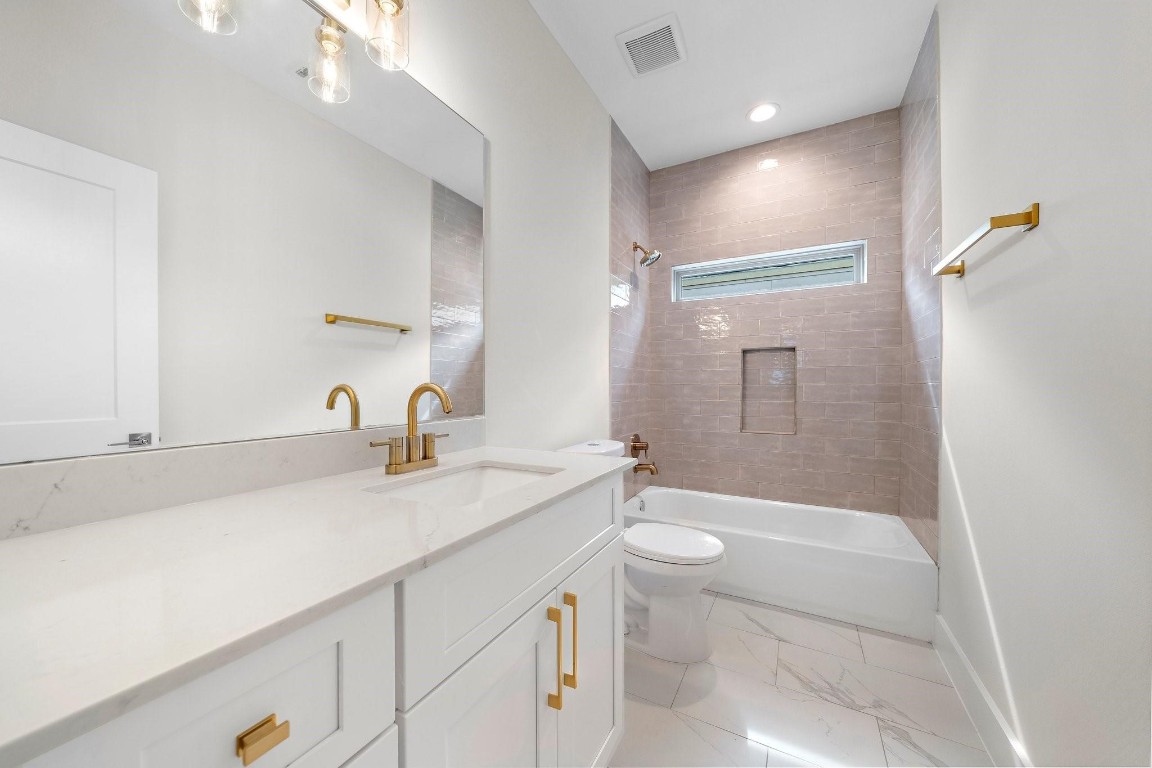 2200 Marnel Road, Unit I Houston, TX 77055 - Photo 19 of 25 a bathroom with a sink a toilet and shower